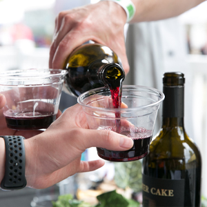 a person holding a bottle of wine